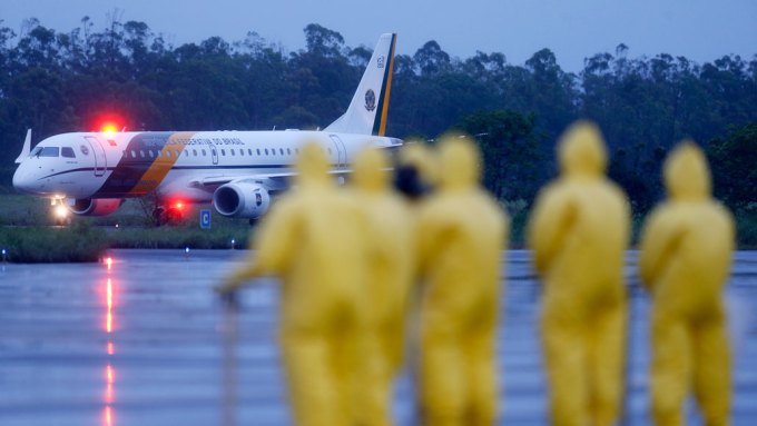 Brazil soldiers meet plane of people from Wuhan, China