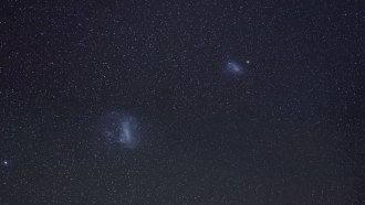 two Magellanic clouds in the night sky over Mayasia