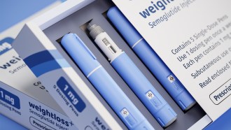 A stock image of a white box containing three blue injector pens. The box is labeled with the words weight loss and semaglutide.