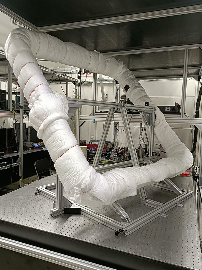 A square frame that holds an interferometer sits on a table in a laboratory.