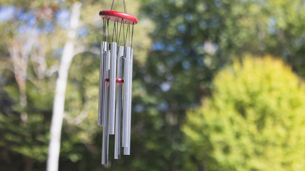 photo of a windchime in a backyard