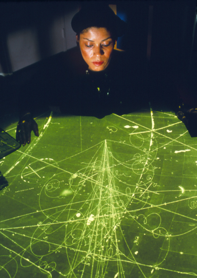 Renee Jones measures particle tracks on a cloud chamber scan