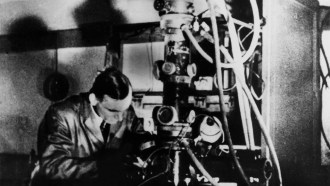 black and white photo of Ernst Ruska at an electron microscope