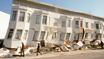 block of row houses off kilter from earthquake damage