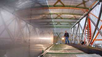 a metallic walkway in the MicroBooNE detector under construction