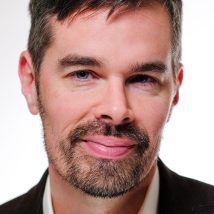 headshot of Associate News Editor Christopher Crockett